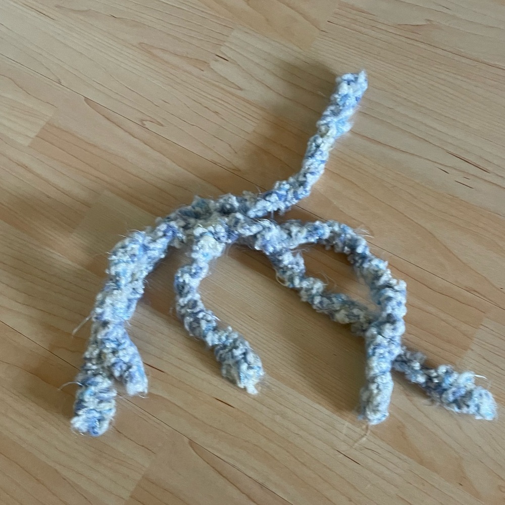 Three mini hand knit scarves